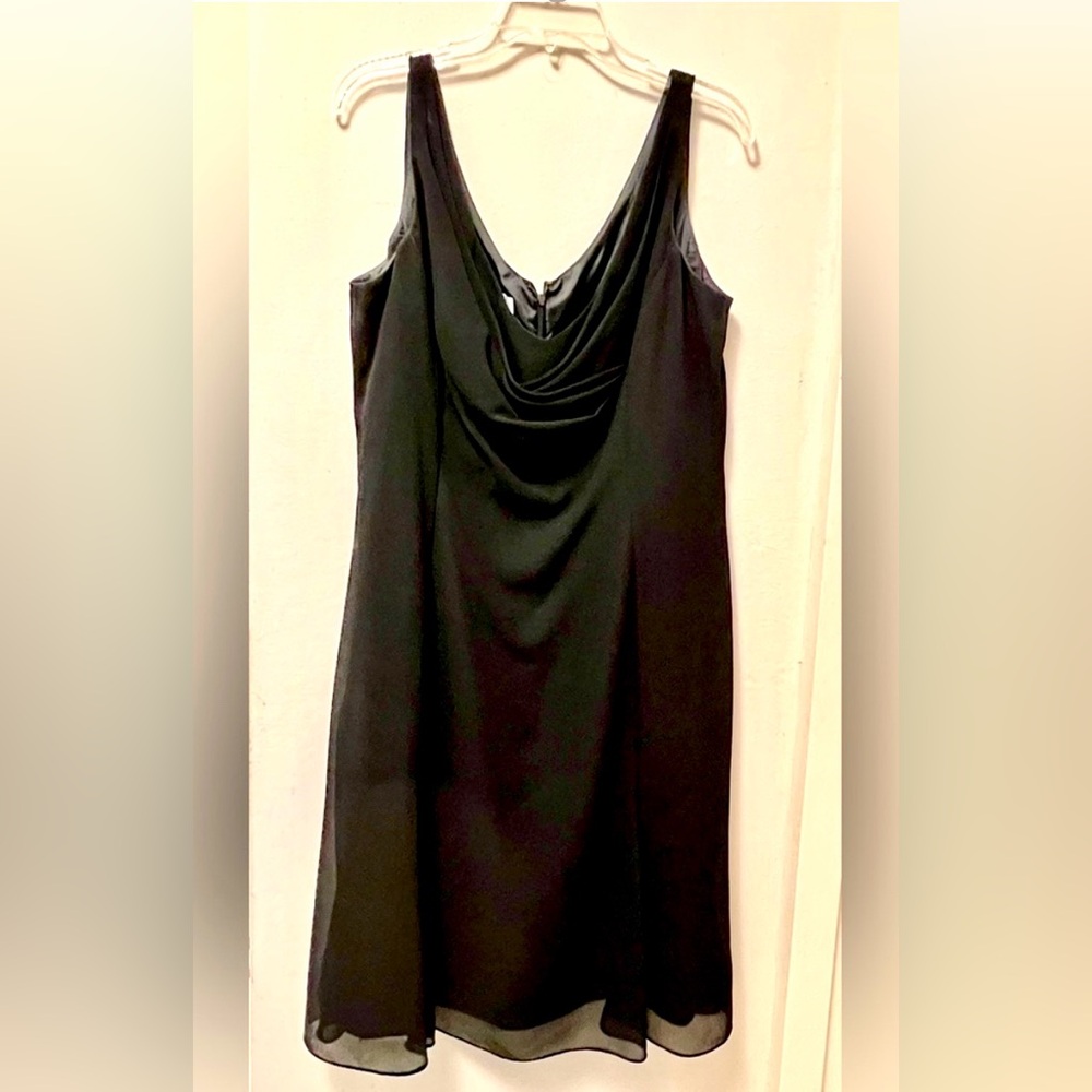 Beautiful black dress, sleeveless, draped in front, fully lined, back zipper.